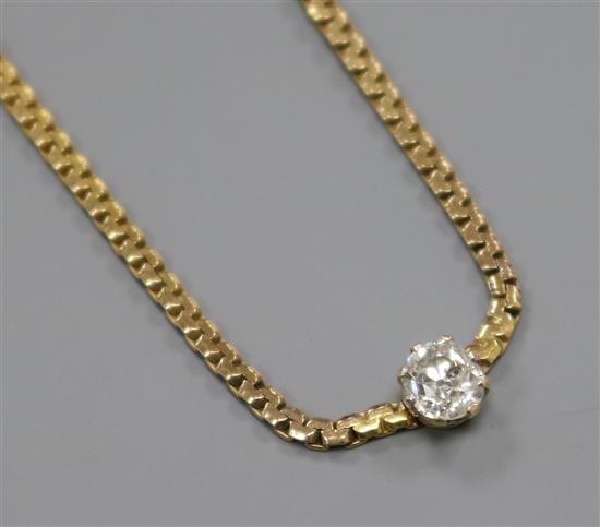A 9ct gold and solitaire diamond set necklace, approx. 36cm.